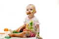 Baby soiled by paint lodges Royalty Free Stock Photo