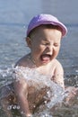 Baby splashing in water