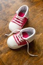 Baby shoes on wood, closeup above view Royalty Free Stock Photo