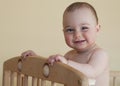 Baby standing in cot