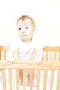 Baby In Standing In Crib Royalty Free Stock Photo