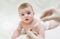 Baby is starring on syringe with immunization vaccine Royalty Free Stock Photo