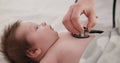 Baby, stethoscope and doctor listening to heart, breathing and test kids healthcare in clinic. Infant, heartbeat and