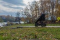 Baby stroller for a small child against the backdrop of a natural forest park, paths of stones, autumn view from the Royalty Free Stock Photo