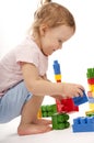 Baby in studiu is playing with toys Royalty Free Stock Photo