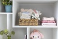 Baby stuff.Little kid apparel.Infant clothes on shelve. Stack of newborn clothing.Maternity Royalty Free Stock Photo