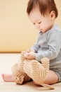 Baby, stuffed animal and playing in home for comfort care, childhood development or game entertainment. Kid, toy teddy