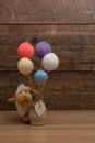 Baby stuffed sheep and colored wool balls, top view