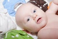 Baby Surrounded by a Rainbow of Cloth Diapers Royalty Free Stock Photo