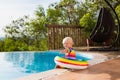 Baby in swimming pool. Kids swim. Child summer fun. Royalty Free Stock Photo