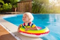 Baby in swimming pool. Kids swim. Child summer fun. Royalty Free Stock Photo