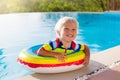 Baby in swimming pool. Kids swim. Child summer fun. Royalty Free Stock Photo