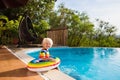 Baby in swimming pool. Kids swim. Child summer fun. Royalty Free Stock Photo