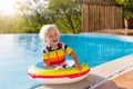 Baby in swimming pool. Kids swim. Child summer fun. Royalty Free Stock Photo