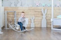 Baby swinging on a rocking chair