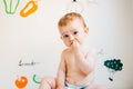 Baby taking handfuls of food to put in his mouth and eat them Royalty Free Stock Photo