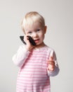 Baby talking over phone Royalty Free Stock Photo