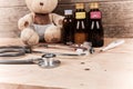 baby teddy bear with stethoscope and medicine