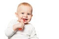 Baby teeth care. Smiling boy brushing his teeth with a toothbrush for infant. Isolated portrait Royalty Free Stock Photo