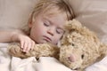 Baby toddler asleep with teddy bear