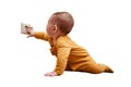 Baby toddler reaches into the electrical outlet on the home wall with hi Royalty Free Stock Photo