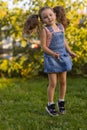 Baby toddler running on green lawn near the house. Royalty Free Stock Photo