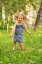 Baby toddler running on green lawn Royalty Free Stock Photo