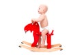 Baby on the toy horse or elk Royalty Free Stock Photo