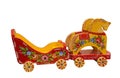 Baby toy wagon pulled by two horses. Russian folk arts and crafts. Arkhangelsk region