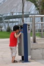 Baby and trash can Royalty Free Stock Photo