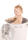 Baby in trash can Royalty Free Stock Photo