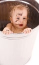 Baby in trash can Royalty Free Stock Photo