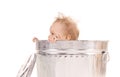 Baby in trash can Royalty Free Stock Photo