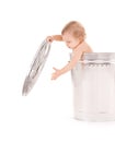 Baby in trash can Royalty Free Stock Photo