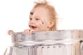 Baby in trash can Royalty Free Stock Photo