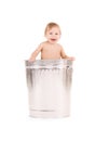 Baby in trash can Royalty Free Stock Photo