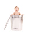 Baby in trash can Royalty Free Stock Photo