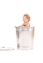 Baby in trash can Royalty Free Stock Photo