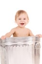 Baby in trash can Royalty Free Stock Photo