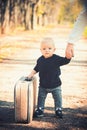 Baby travel on vacation with suitcase. Kid with packed luggage, family and child holiday Royalty Free Stock Photo