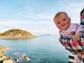 Baby traveler enjoying sea view travel family active lifestyle