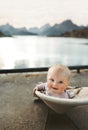 Baby traveling in Norway family vacations lifestyle outdoor cute child happy smiling