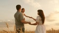 Baby travels across field with her family. child and parent are playing. happy family and childhood concept. Happy baby Royalty Free Stock Photo