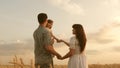 Baby travels across field with her family. child and parent are playing. happy family and childhood concept. Happy baby Royalty Free Stock Photo