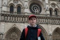 Baby travels. Facade of the Cathedral of Notre Dame de Paris France 03.20.2019 Royalty Free Stock Photo