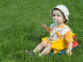 A baby in the truck on the grass Royalty Free Stock Photo