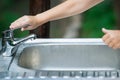 Baby try to turn off water faucet but water still leak. A child`s hand turning off the tap. Save water. World Water Monitoring Da Royalty Free Stock Photo