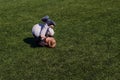 Baby tumbles on green artificial cover outdoors Royalty Free Stock Photo