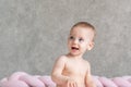 The baby turned around in surprise at the sound and opened his mouth in surprise Royalty Free Stock Photo