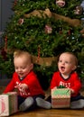 Baby twins with Christmas presents